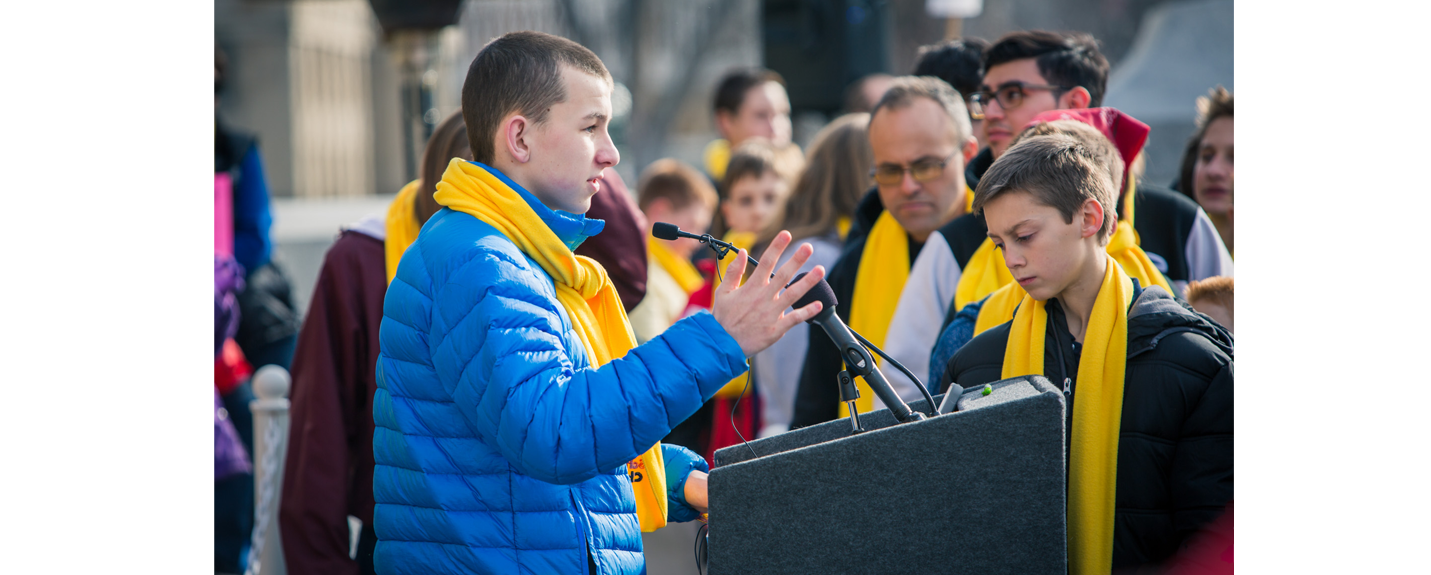 A student stands at the podium at the Boise Capital to discuss National School Choice Week