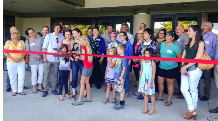 Sage students and families cut the ribbon on Sages new unified building