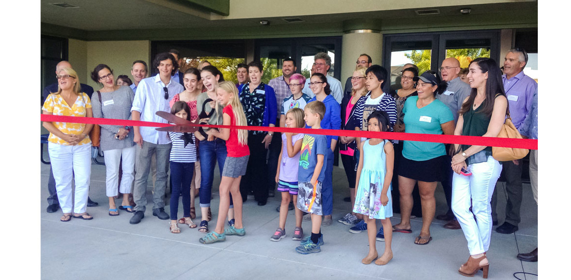 Sage students and families cut the ribbon on Sages new unified building