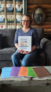 Sue Smith sits with her book series