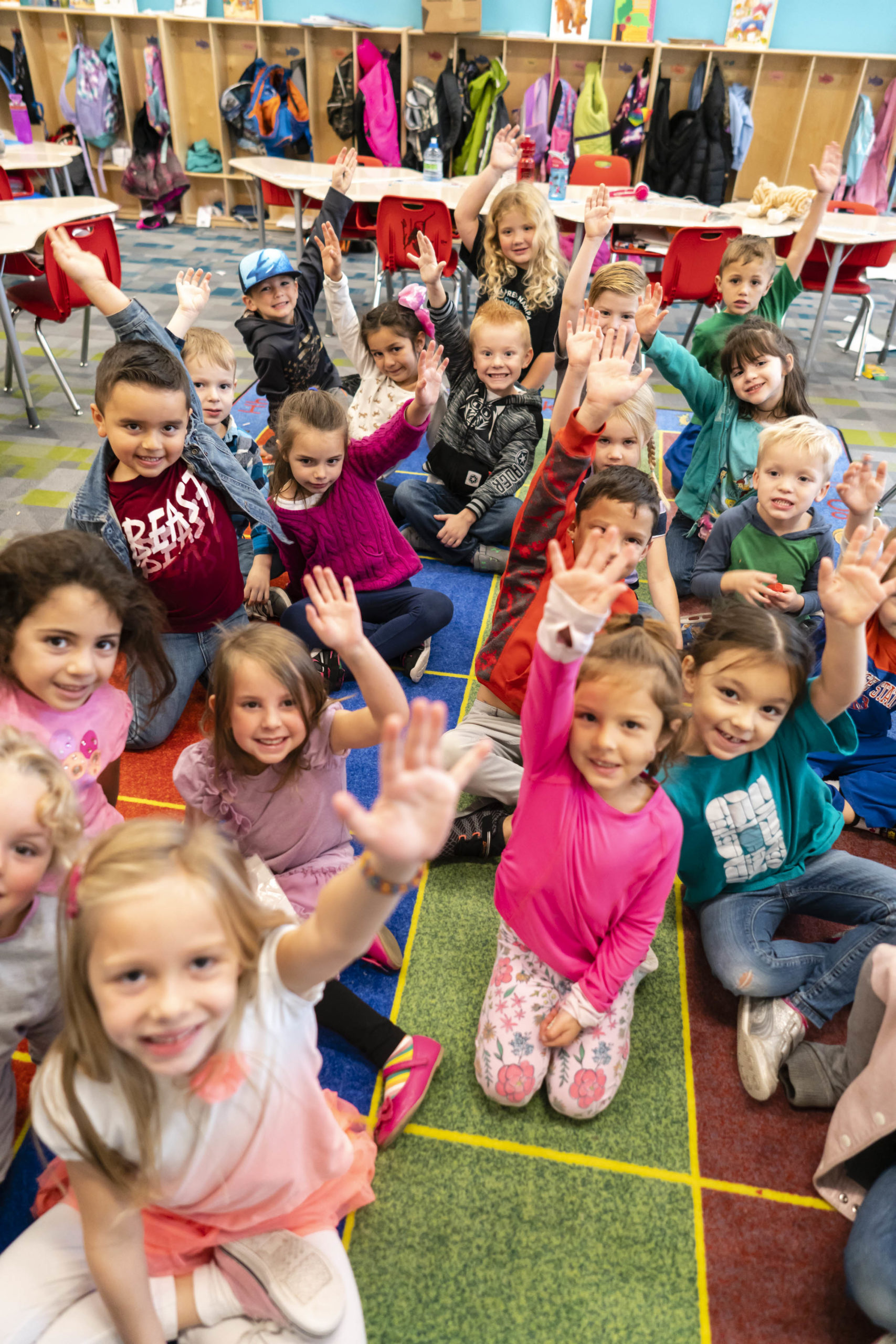 Children in a kindergarten class smile at the camera at Gem Prep in Nampa