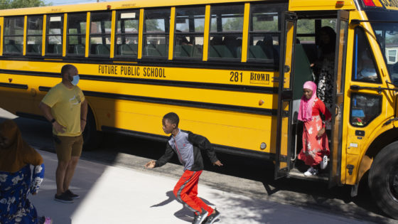 Kids run off the school bus at Future Public School