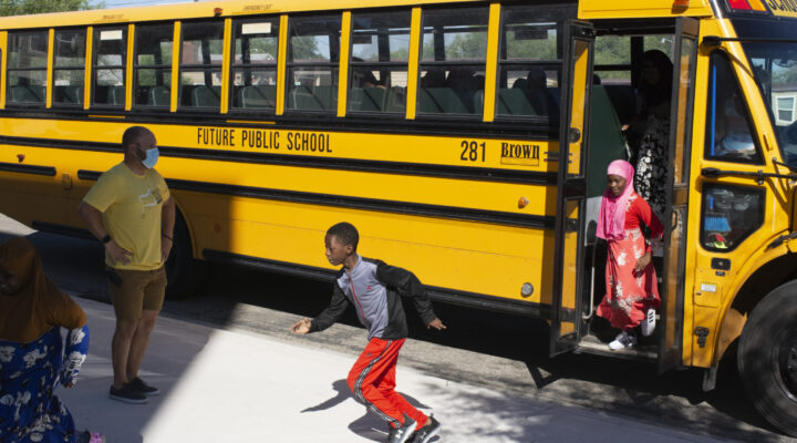 Kids run off the school bus at Future Public School