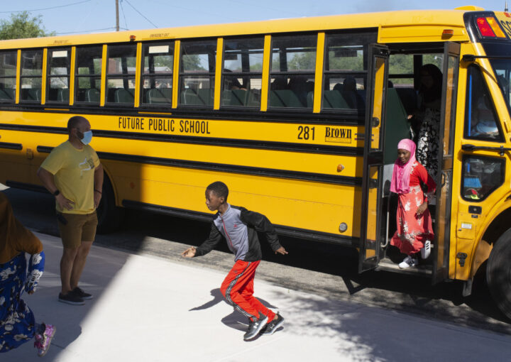 Kids run off the school bus at Future Public School