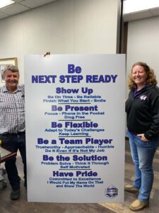 Monica and Don stand at Steelhead with the Next Step Ready Sign 