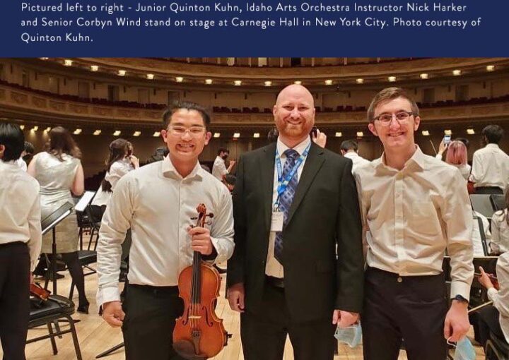 IACS students stand on stage at Carnegie Hall with their instructor